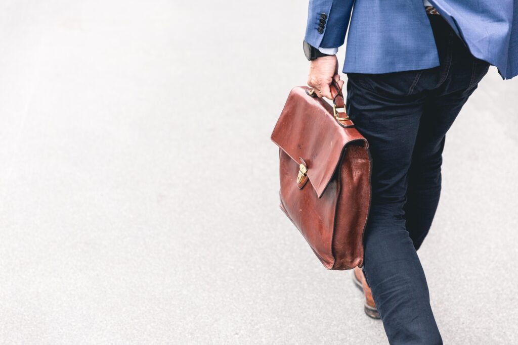 executive walking with briefcase